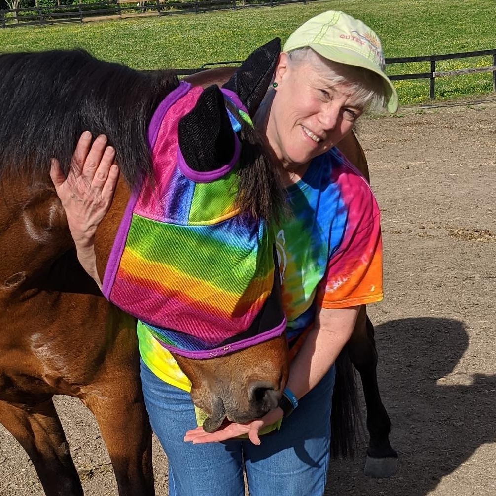 Woman hugging horse